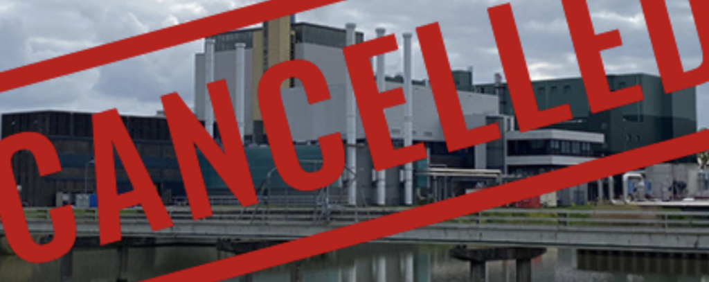 Comité Schone Lucht Ein Kraftwerk und darüber der Text "Cancelled"